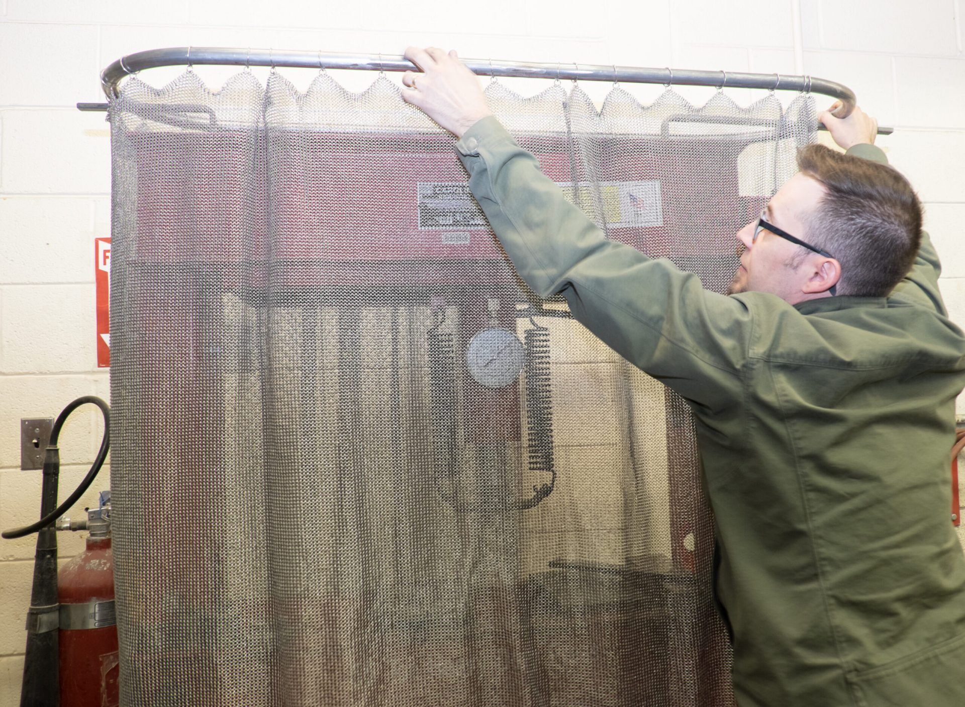 Custom chainmail hydraulic press guard moves to the side, stays installed